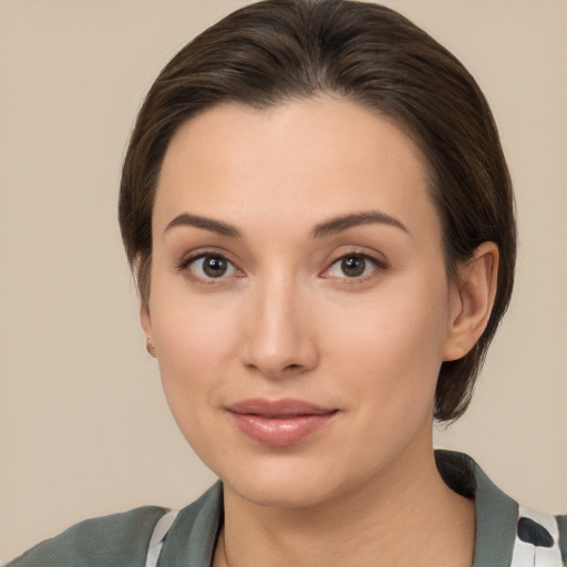 Neutral white young-adult female with medium  brown hair and brown eyes