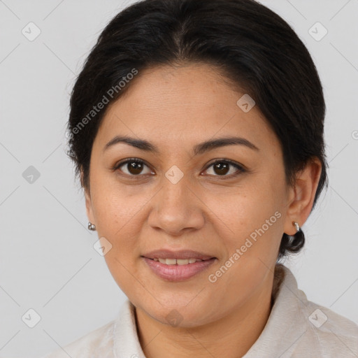 Joyful latino young-adult female with medium  brown hair and brown eyes