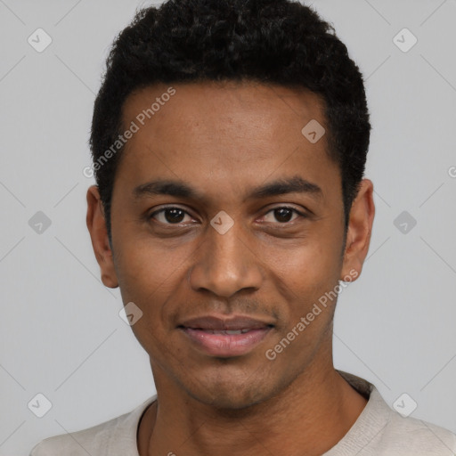 Joyful black young-adult male with short  black hair and brown eyes