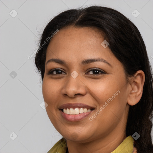 Joyful latino young-adult female with medium  brown hair and brown eyes