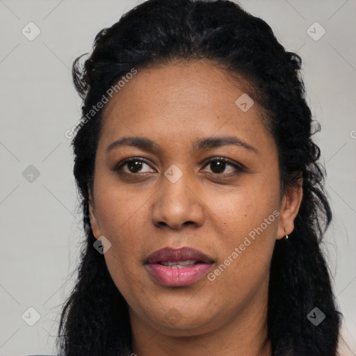 Joyful latino young-adult female with long  black hair and brown eyes