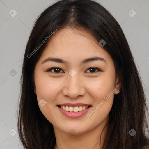 Joyful asian young-adult female with long  brown hair and brown eyes