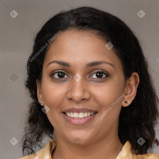 Joyful black young-adult female with medium  brown hair and brown eyes