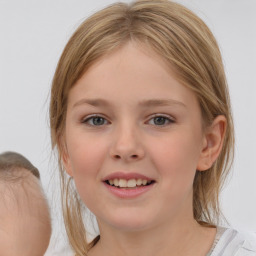 Joyful white child female with medium  brown hair and brown eyes