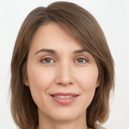 Joyful white young-adult female with medium  brown hair and brown eyes