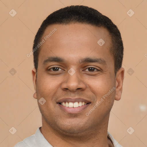 Joyful latino young-adult male with short  brown hair and brown eyes