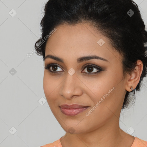 Joyful latino young-adult female with medium  brown hair and brown eyes