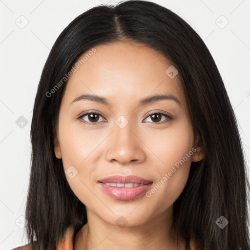 Joyful latino young-adult female with long  brown hair and brown eyes