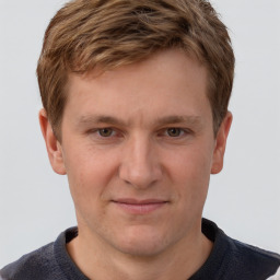 Joyful white adult male with short  brown hair and grey eyes