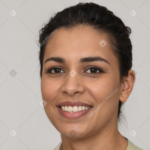 Joyful latino young-adult female with short  brown hair and brown eyes