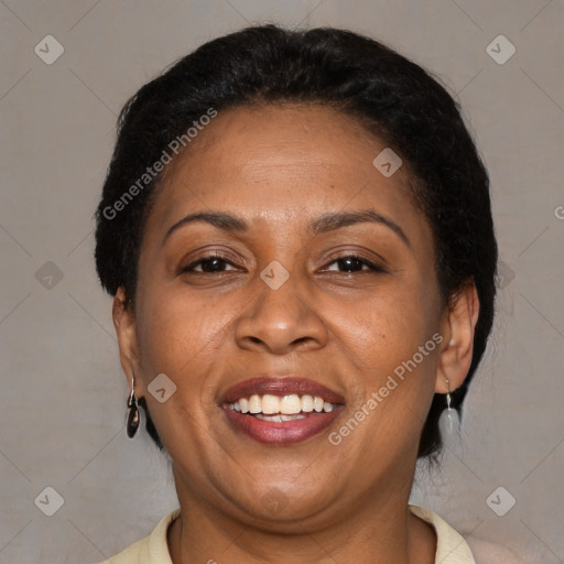 Joyful latino adult female with short  brown hair and brown eyes