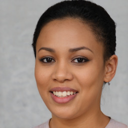 Joyful latino young-adult female with short  brown hair and brown eyes