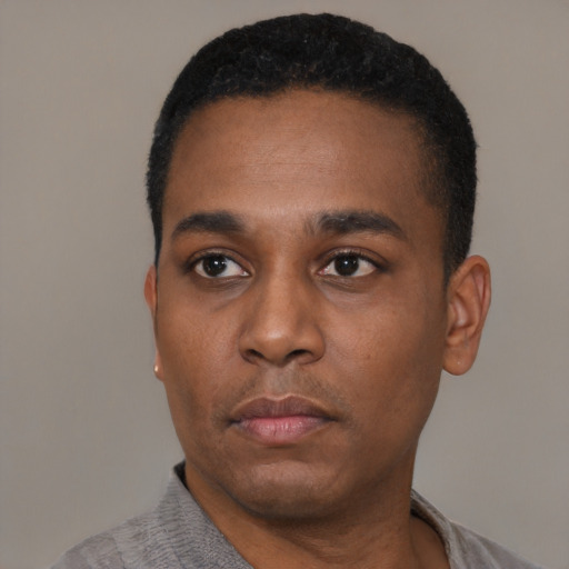 Neutral black young-adult male with short  black hair and brown eyes