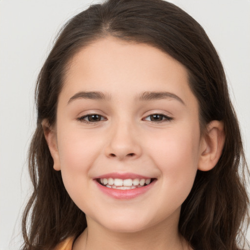 Joyful white child female with long  brown hair and brown eyes