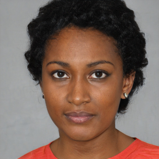 Neutral black young-adult female with short  black hair and brown eyes