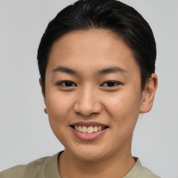 Joyful asian young-adult female with short  brown hair and brown eyes