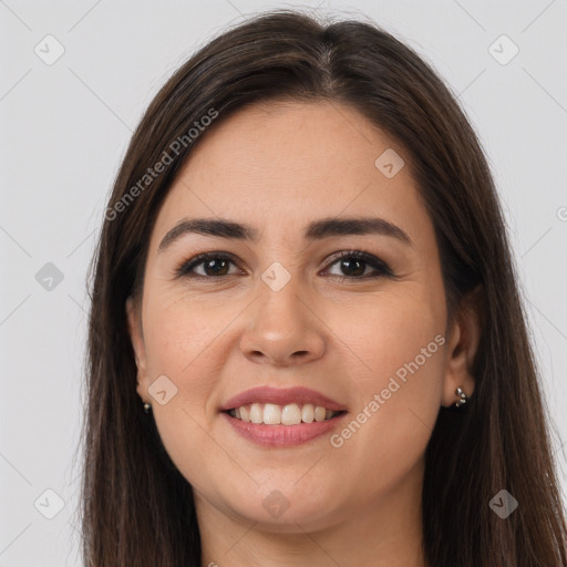 Joyful white young-adult female with long  brown hair and brown eyes