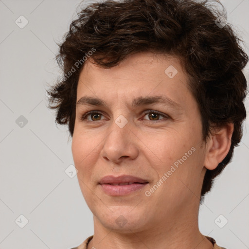 Joyful white adult female with short  brown hair and brown eyes