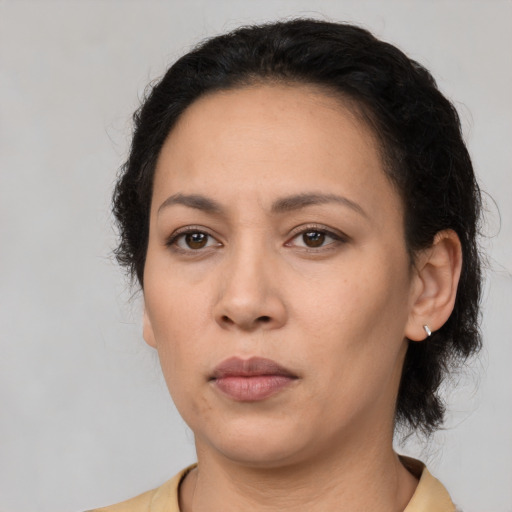 Neutral latino adult female with medium  black hair and brown eyes