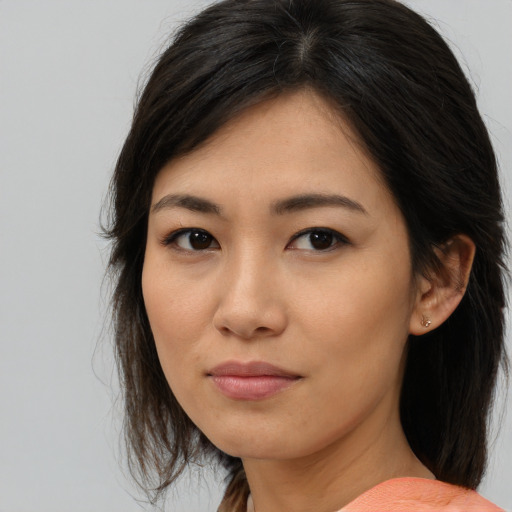 Neutral asian young-adult female with medium  brown hair and brown eyes