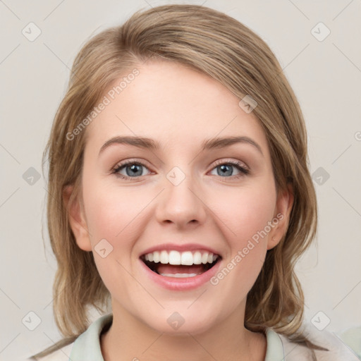 Joyful white young-adult female with medium  brown hair and green eyes