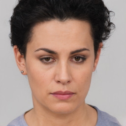 Neutral white young-adult female with short  brown hair and brown eyes