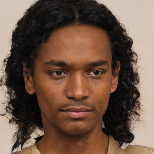 Neutral black young-adult male with medium  black hair and brown eyes