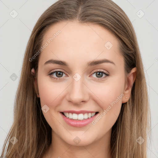 Joyful white young-adult female with long  brown hair and grey eyes