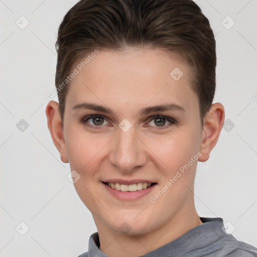 Joyful white young-adult female with short  brown hair and grey eyes