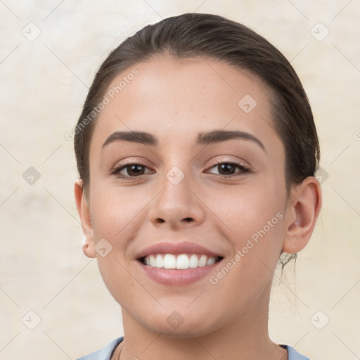 Joyful white young-adult female with short  brown hair and brown eyes