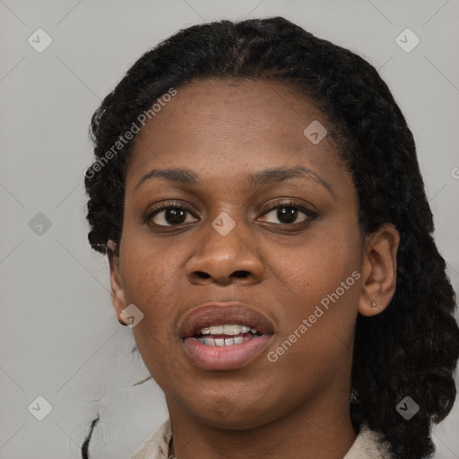 Joyful black young-adult female with short  black hair and brown eyes