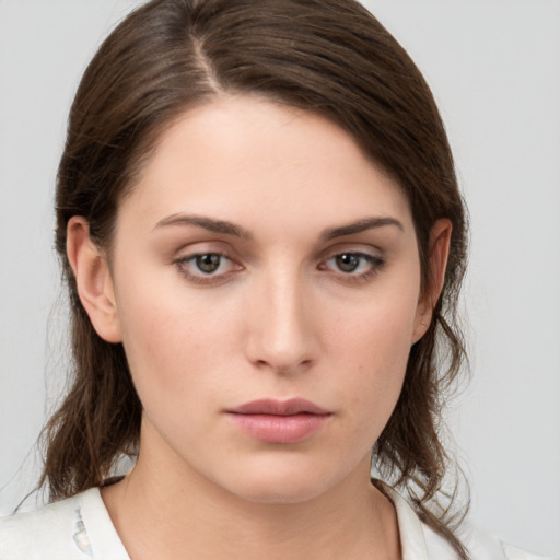 Neutral white young-adult female with medium  brown hair and brown eyes