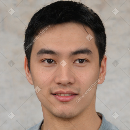 Joyful asian young-adult male with short  black hair and brown eyes