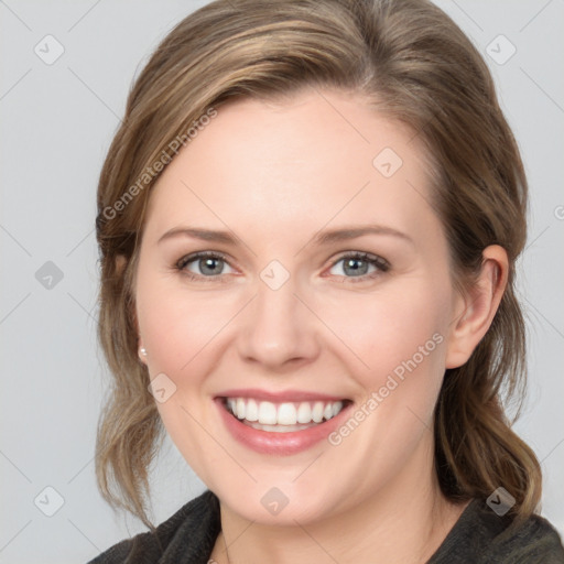 Joyful white young-adult female with medium  brown hair and blue eyes