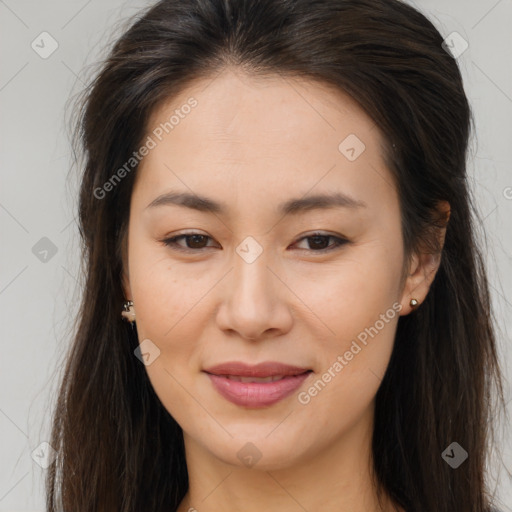 Joyful asian young-adult female with long  brown hair and brown eyes