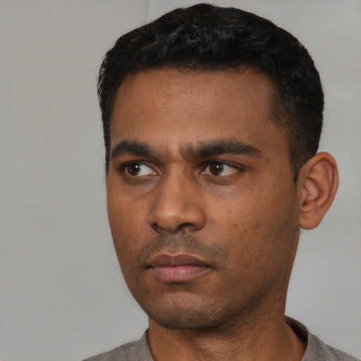 Neutral latino young-adult male with short  black hair and brown eyes