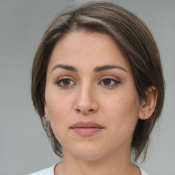 Neutral white young-adult female with medium  brown hair and brown eyes