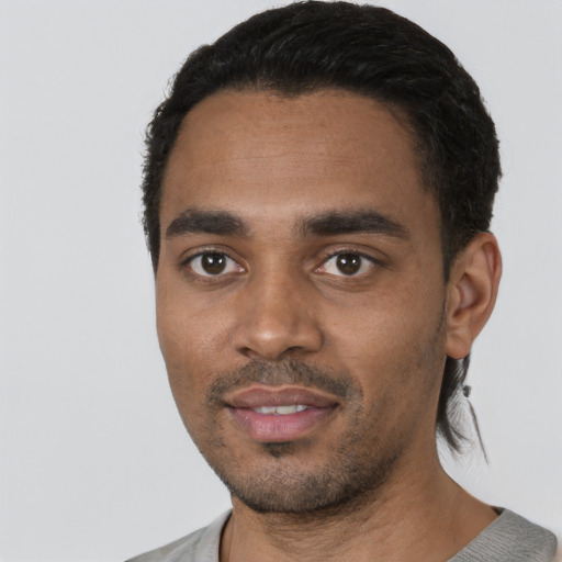 Neutral black young-adult male with short  black hair and brown eyes