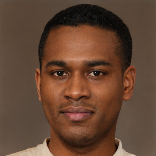 Joyful latino young-adult male with short  brown hair and brown eyes