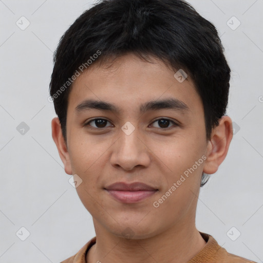 Joyful asian young-adult male with short  brown hair and brown eyes