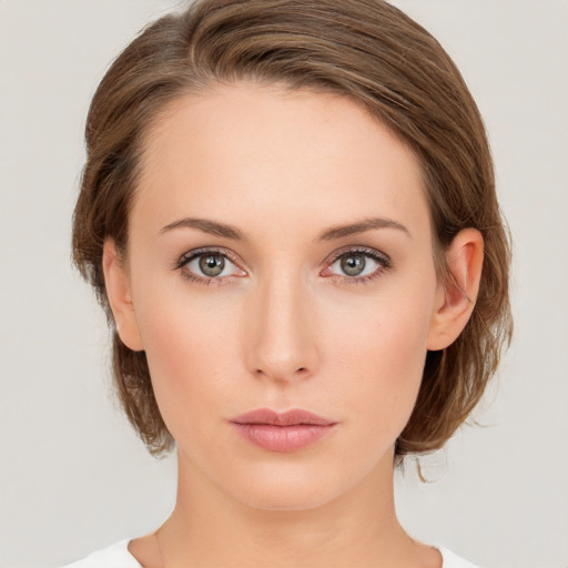 Neutral white young-adult female with medium  brown hair and green eyes