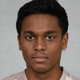 Neutral black young-adult male with short  brown hair and brown eyes