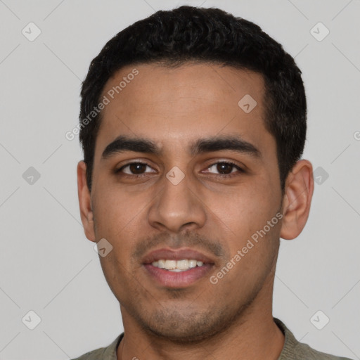 Joyful latino young-adult male with short  black hair and brown eyes