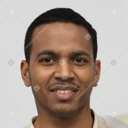 Joyful black young-adult male with short  black hair and brown eyes