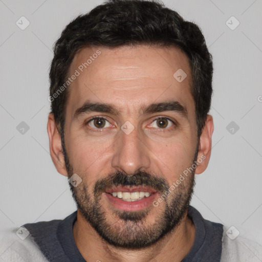 Joyful white adult male with short  black hair and brown eyes