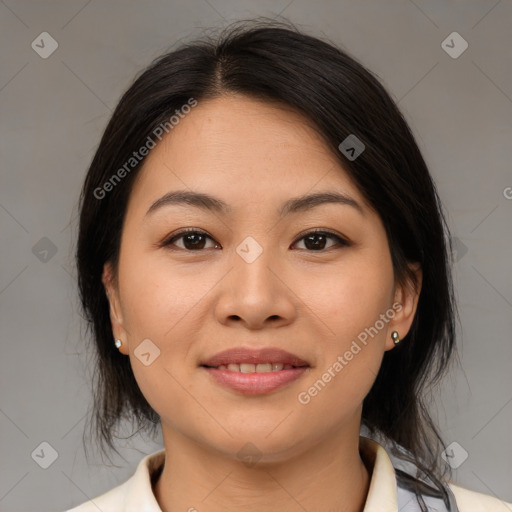 Joyful latino young-adult female with medium  brown hair and brown eyes