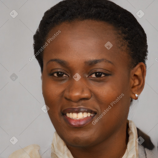 Joyful black young-adult female with short  black hair and brown eyes