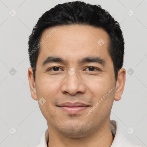 Joyful latino young-adult male with short  black hair and brown eyes