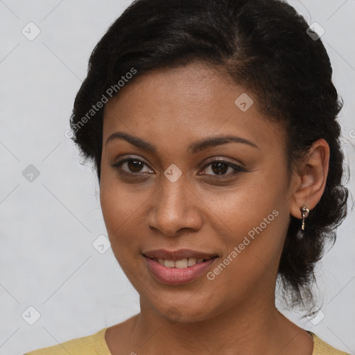 Joyful black young-adult female with short  brown hair and brown eyes