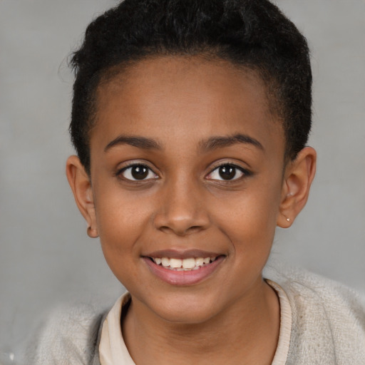 Joyful black child female with short  brown hair and brown eyes